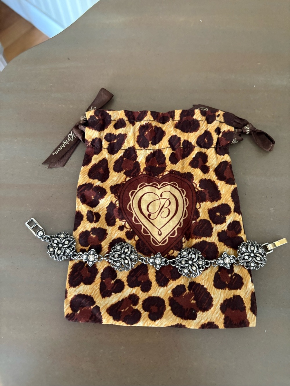 Silver Brighton Floral Link Bracelet on Leopard Pouch